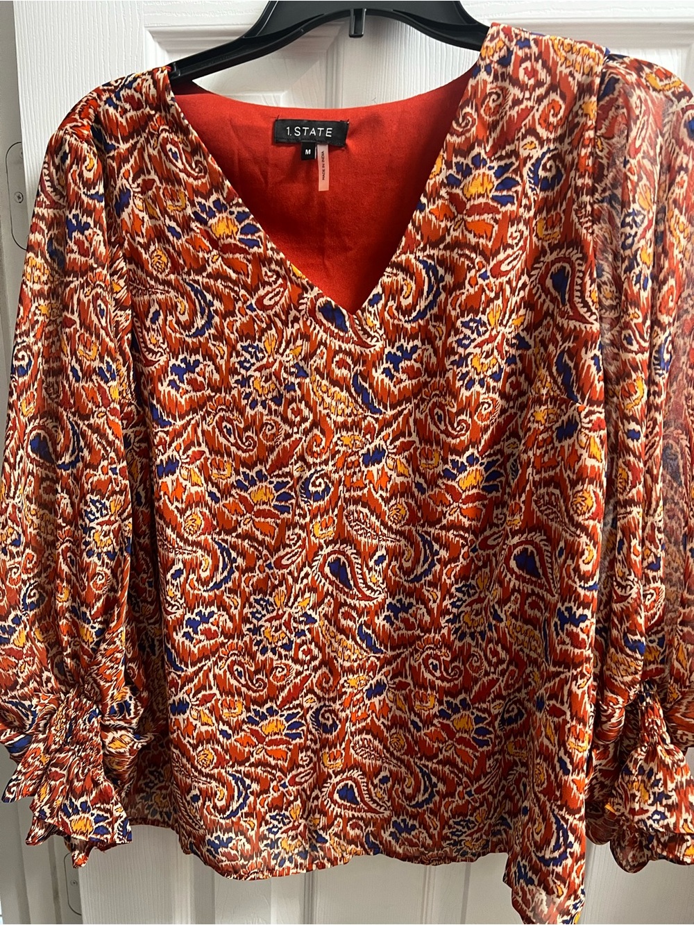 1. State Orange Paisley V-Neck Blouse with Blue and Yellow Accents